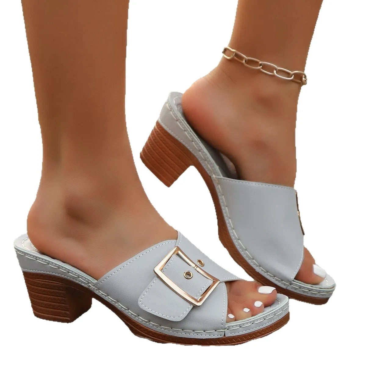 Women's black chunky heel slippers with a metal buckle on the strap and a rubber sole.