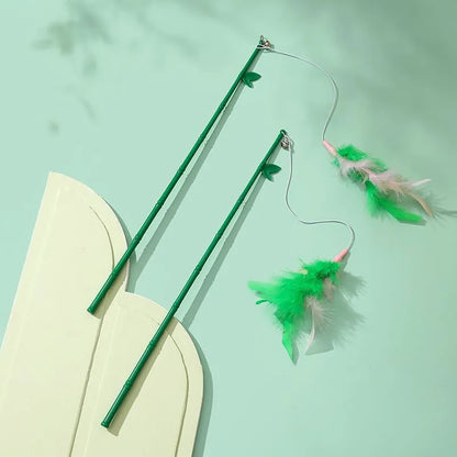 Green interactive cat feather wand toy with bell for durable feline play and stimulation