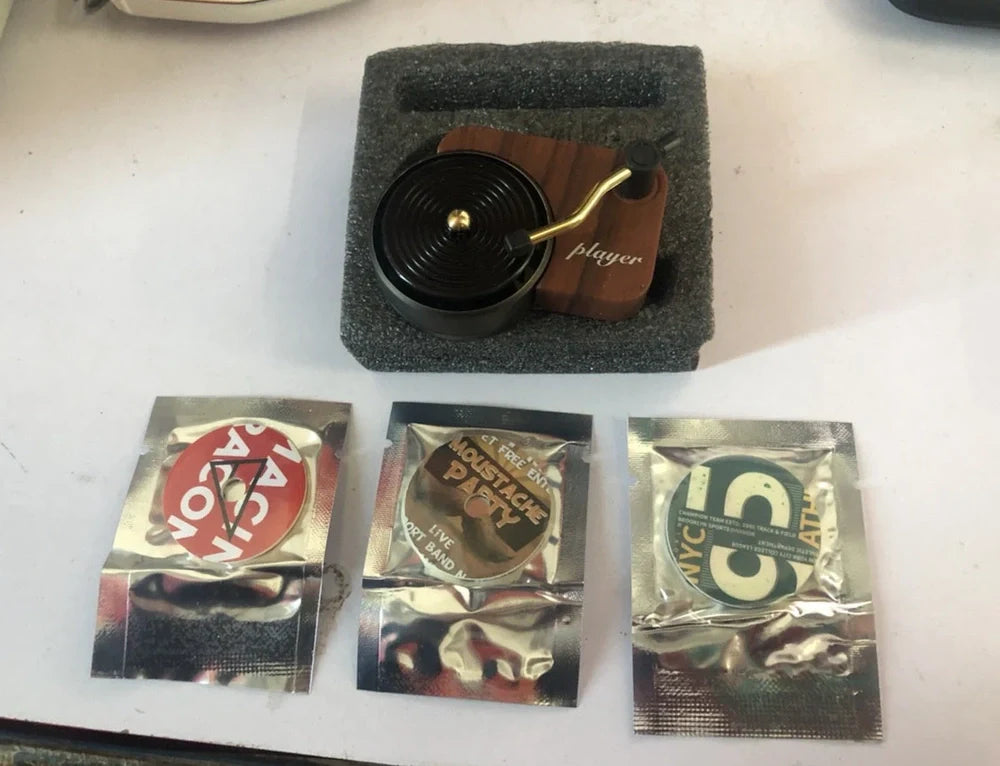 Rainbow coloured moon phase wall decoration with circular iron framework and hanging chain