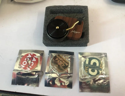 Rainbow coloured moon phase wall decoration with circular iron framework and hanging chain