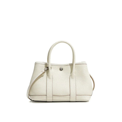 Genuine leather crossbody bag for women in first layer cowhide, horizontal square shape, single shoulder strap, shown in chicken yellow