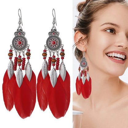 Bohemian feather leaf pattern alloy earrings in round drop shape on a colour selection background.