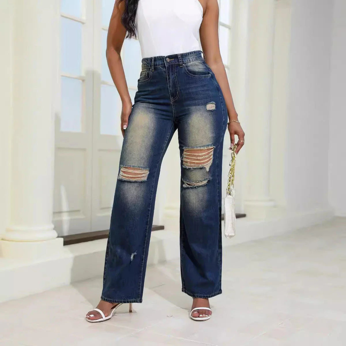 Stylish ripped high-waist jeans with pockets, made from durable denim and cotton-silk blend for comfort and fashion.
