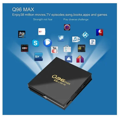 Q96 MAX Android TV set-top box with remote control and HDMI cable on a wooden surface.