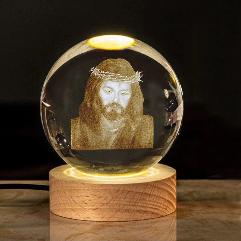 White crystal ball ornament with solid wood warm light base, showing purity engravings like Cross and Maria for desk decor