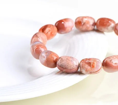 Natural cherry agate barrel bead bracelet with 10x14mm geometry design and Ruyi elements on wrist