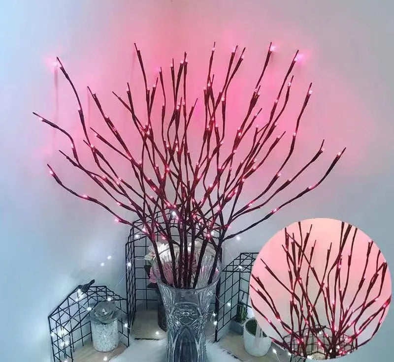 Silver branch LED tree light in a vase with multiple colour change modes including blue, pink, and warm white.