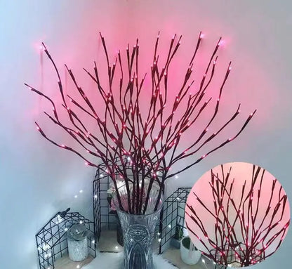 Silver branch LED tree light in a vase with multiple colour change modes including blue, pink, and warm white.