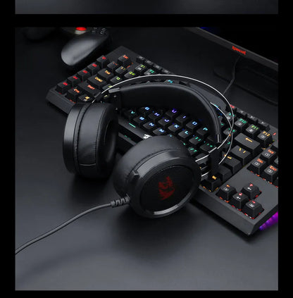 Black wired PC gaming headset with over-ear cups and a 3.5mm audio jack.