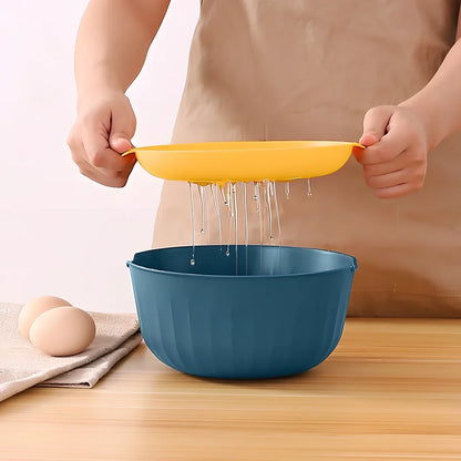 Blue and yellow kitchen egg separator with drainage channels for yolk and white separation