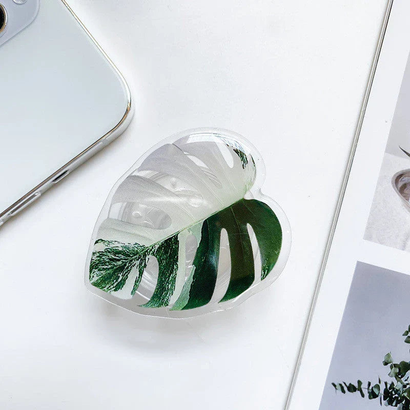 Stylish leaf-inspired smartphone stand with secure grip and adjustable viewing angle for hands-free use