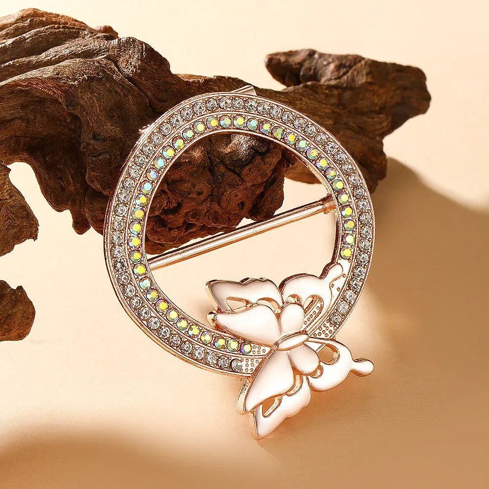 Bow-shaped waist-cinching accessory clip for high-end brooches, alloy with electroplating and diamond inlay, shown in gold, silver, or rose gold finishes.