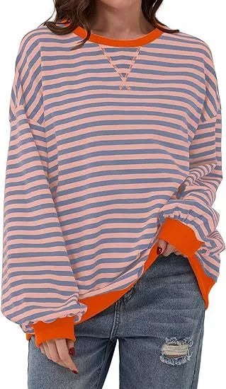 Striped sweatshirt in navy blue, pink, and orange with contrasting colors and ribbed cuffs