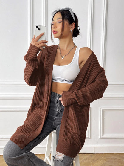 Women's dark green cardigan with two front pockets, 65cm length, loose fit design with long sleeves