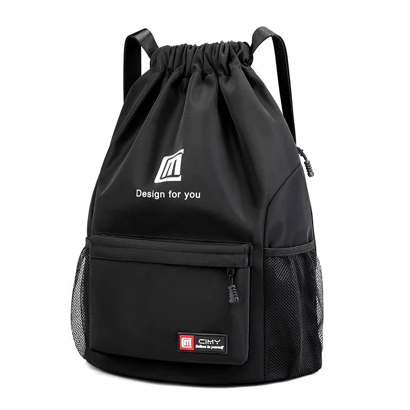 Large bucket-shaped travel backpack in blue with drawstring closure and soft black shoulder straps.