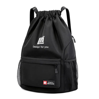 Large bucket-shaped travel backpack in blue with drawstring closure and soft black shoulder straps.