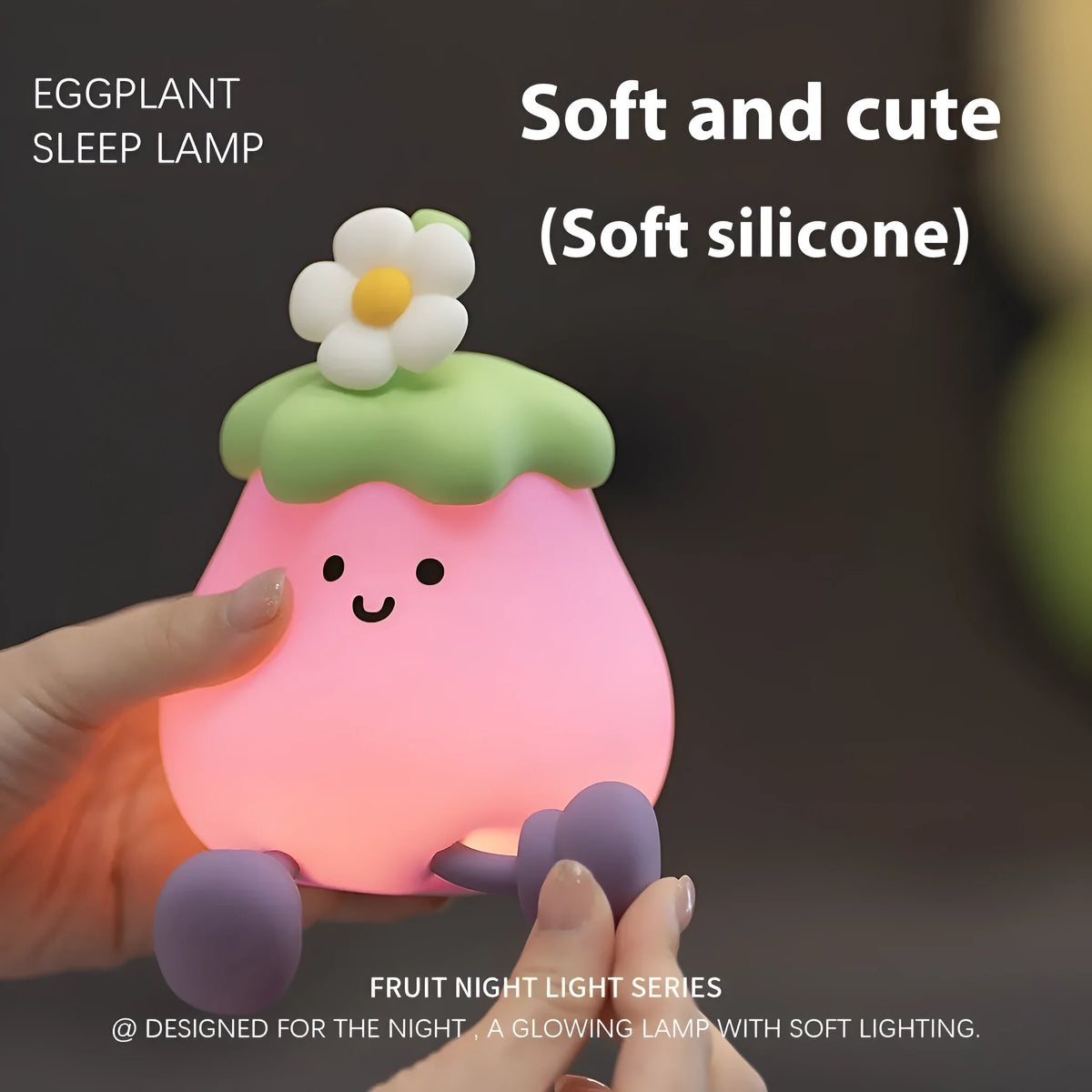 Cartoon eggplant shaped night lamp emitting soft yellow light, showing compact dimensions