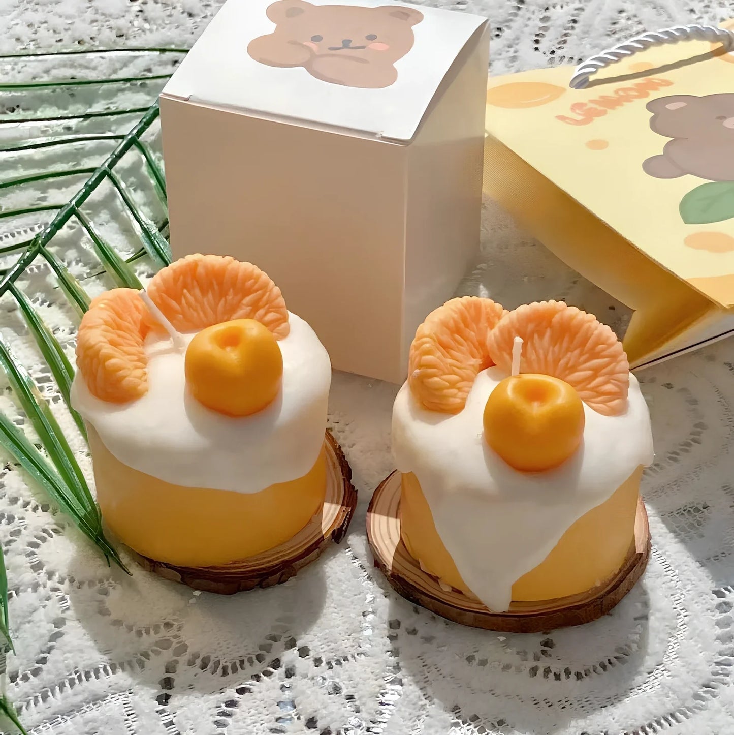 Handmade orange soy wax candle with 5cm diameter and 6cm height in cylindrical shape