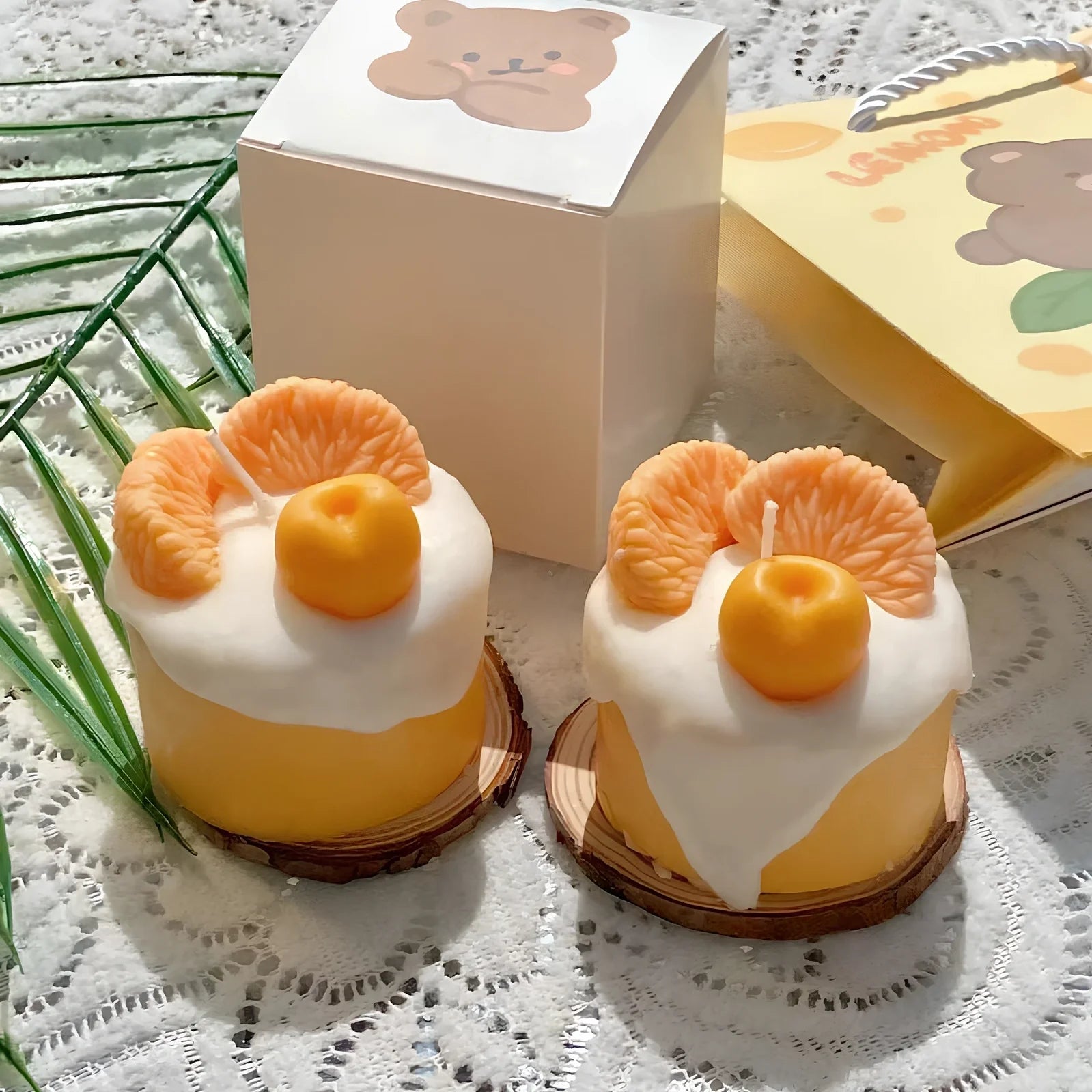 Handmade orange soy wax candle with 5cm diameter and 6cm height in cylindrical shape