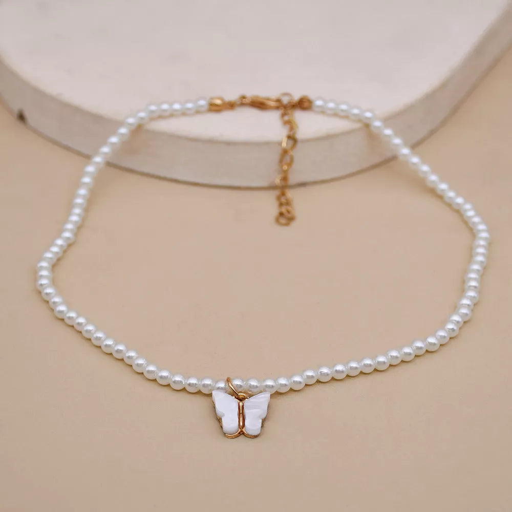 Elegant white pearl choker necklace with butterfly charm for women