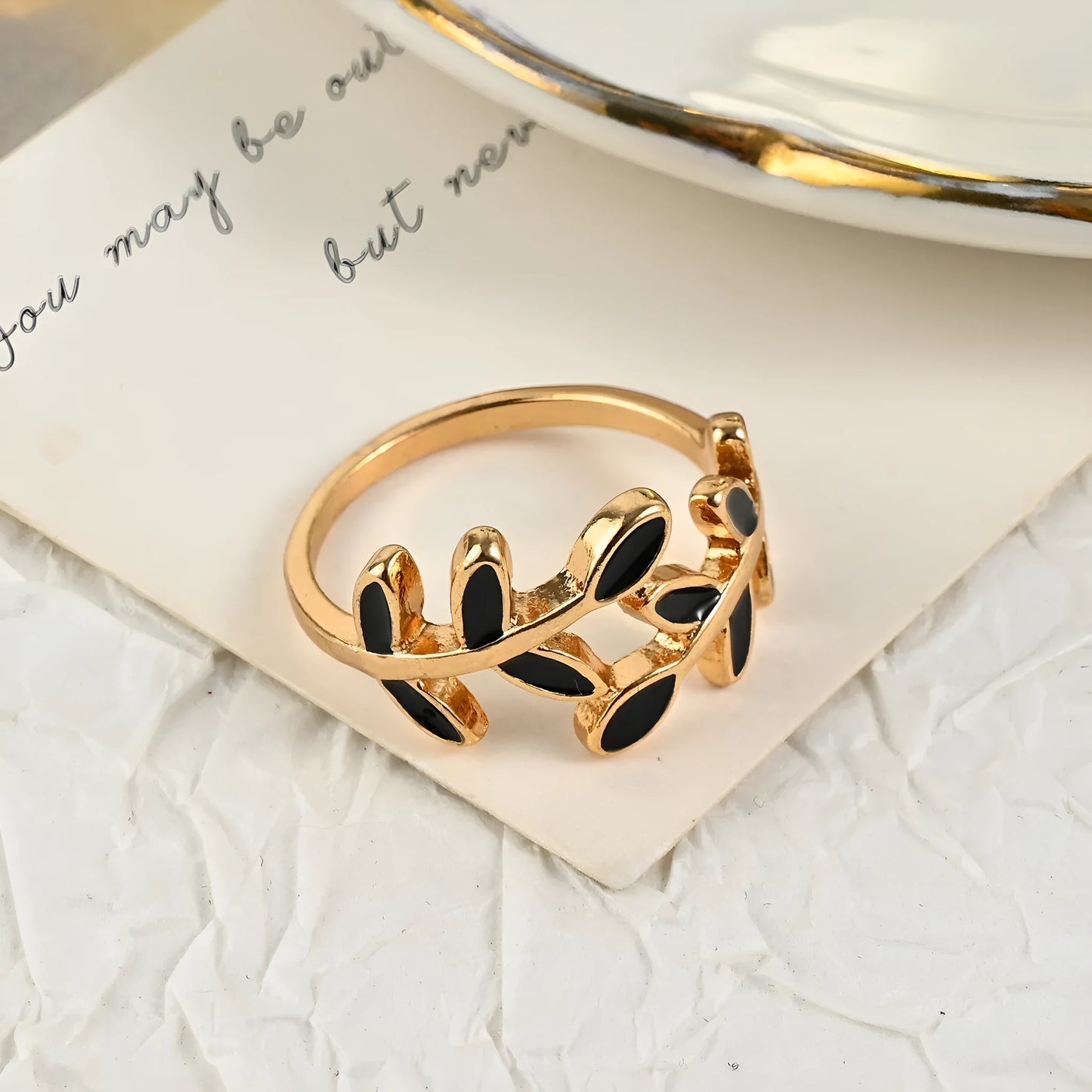 Gold electroplated geometric ring with leaf motif and acrylic accents for women's index finger