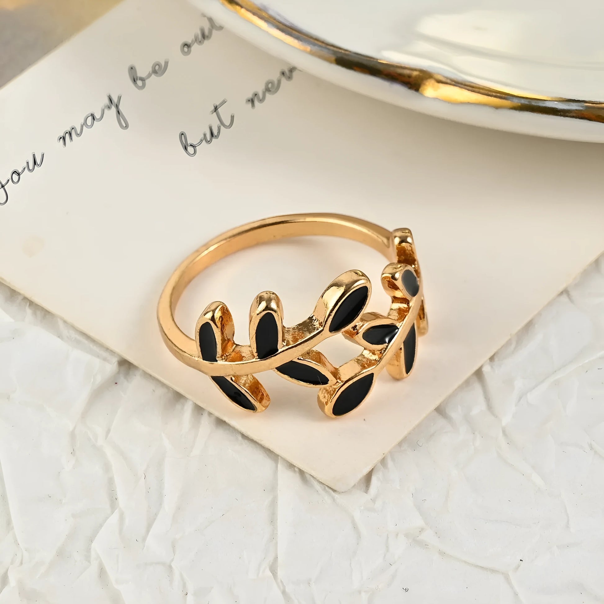 Gold electroplated geometric ring with leaf motif and acrylic accents for women's index finger