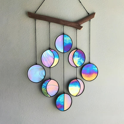 Rainbow coloured moon phase wall decoration with circular iron framework and hanging chain