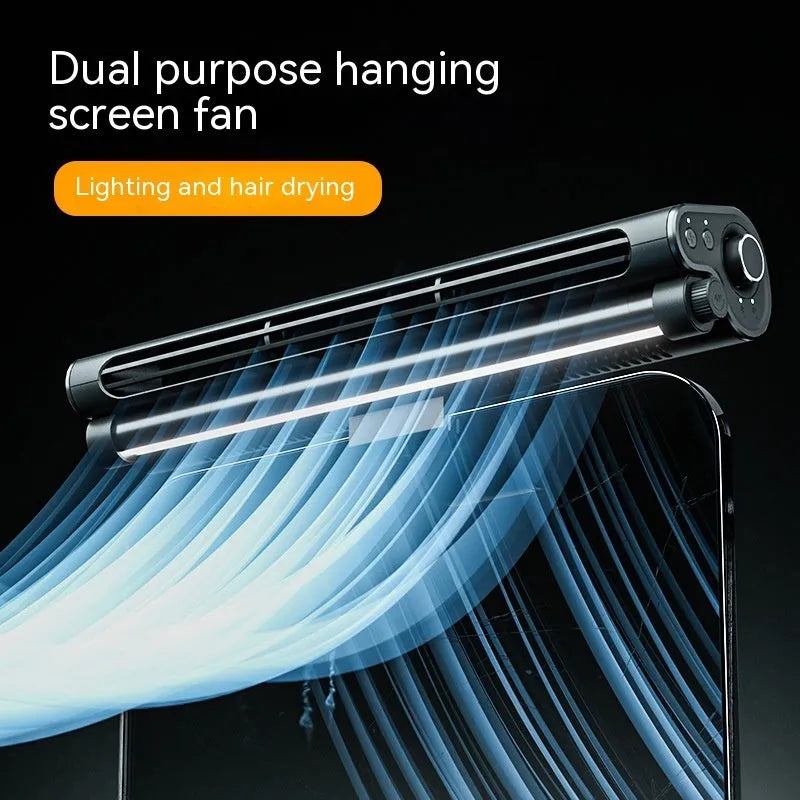 Black bladeless USB fan with lighting lamp clamped to laptop screen showing 32.5cm width