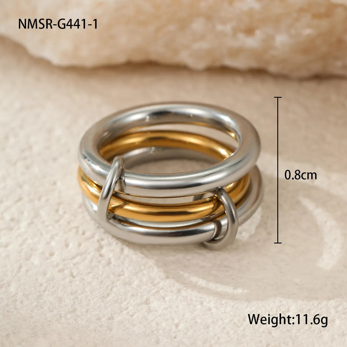 Stacked stainless steel rings with 18K gold plating in three colour variations, exaggerated hand jewellery designs