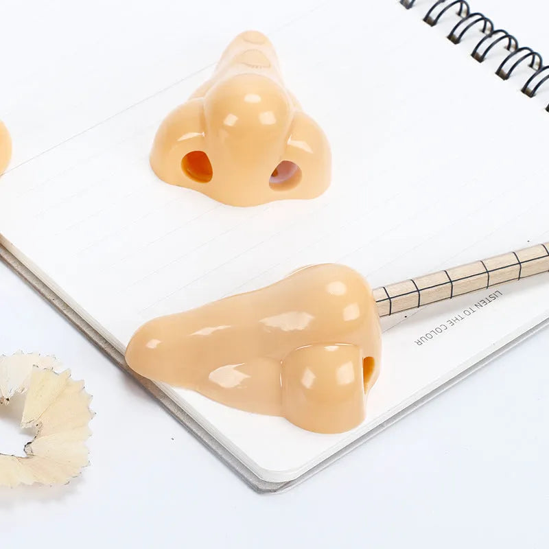 Geometry-shaped plastic pencil sharpener measuring 58x45x30mm in flesh colour