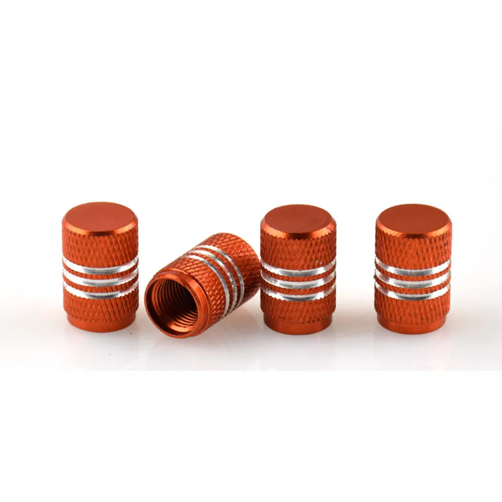 Set of stainless steel car tyre valve caps in multiple colours: black, red, blue, gold, silver, green, purple, sky blue, grey, orange.