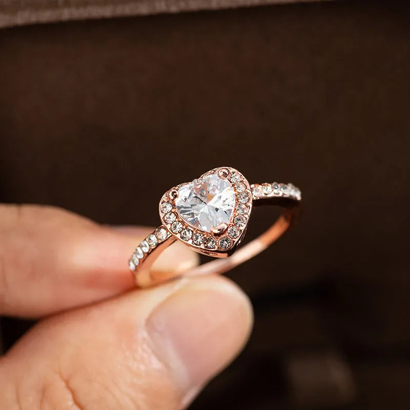 Women's wedding ring in fashion crystal heart shape with rose gold or silvery finish, available in sizes 5 through 10, made from electroplated white copper with a Christmas-inspired style for wedding ceremonies and romantic occasions.