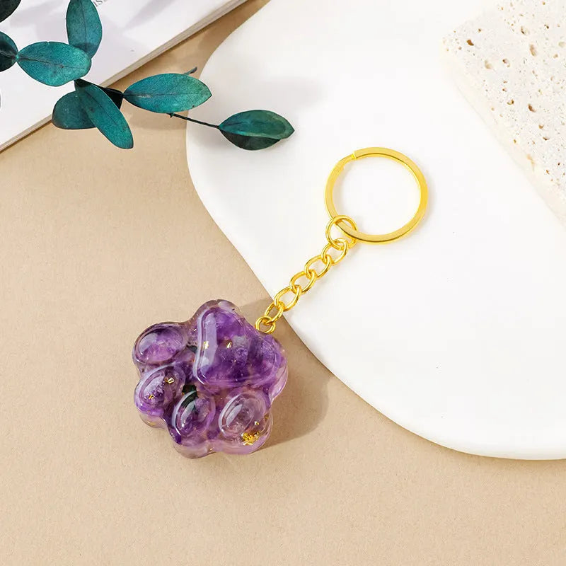 Natural crystal cat's paw keychain pendant showing gemstone options with integrated attachment loop