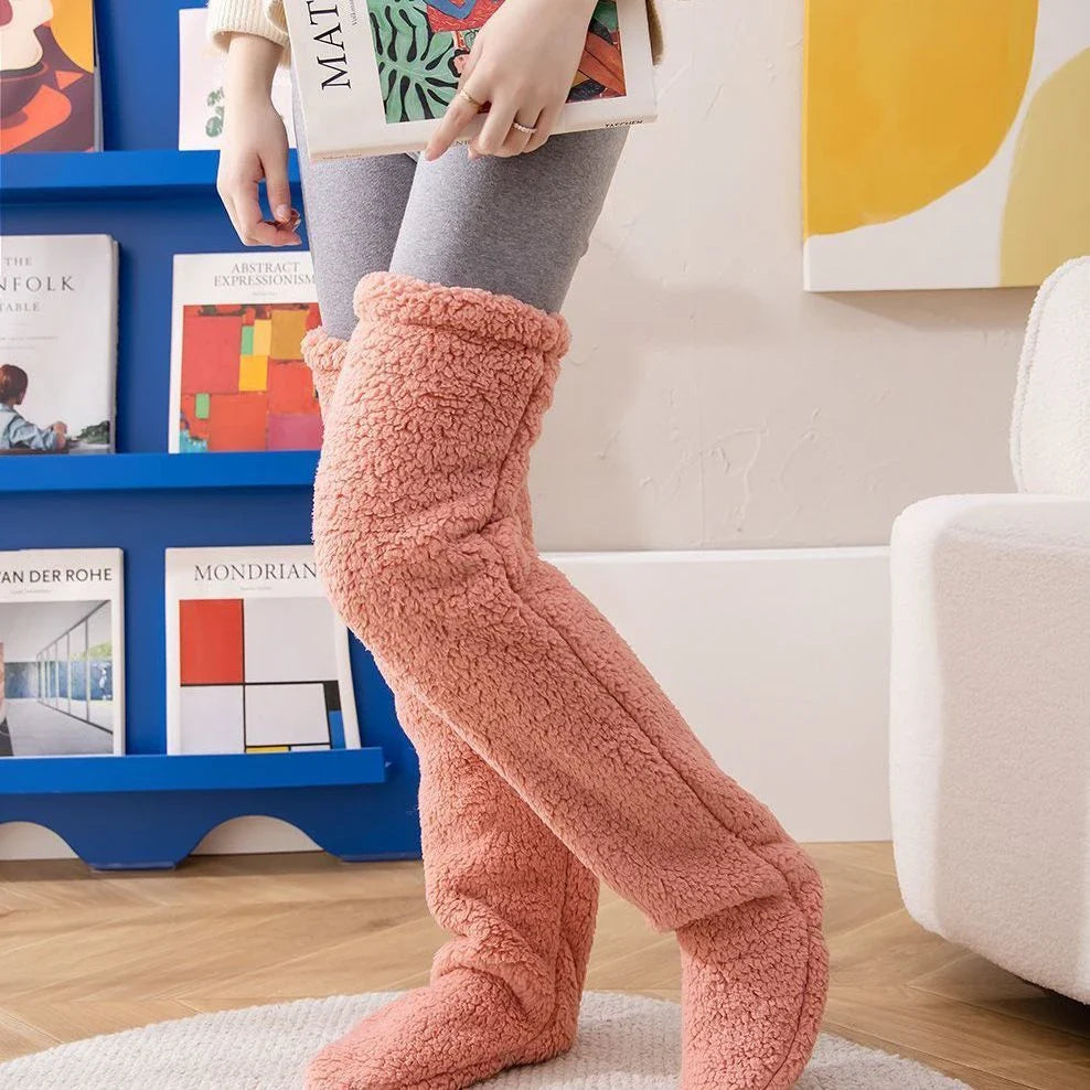 Cozy over-the-knee fuzzy socks in various colors, including brown, blue, dark gray, pink, silver, and more. Comfortable cotton design for warm, snug legs.