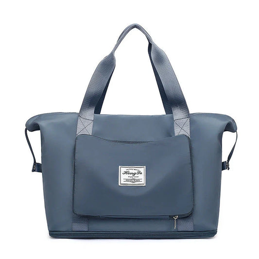 Roomy and foldable gym bag for women with waterproof Oxford fabric, multiple pockets, and wet/dry separation compartment