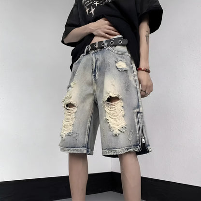 Blue denim shorts with wide-leg cut and tattered retro detailing on mannequin