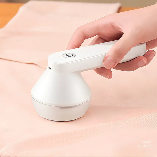 White and green charging shaving machine with straight plug design measuring 13.5cm