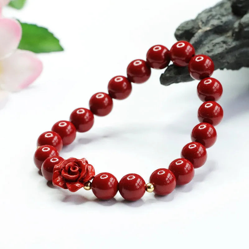 Close-up of a handmade purple gold sand cinnabar rose bracelet with an 8mm bead.