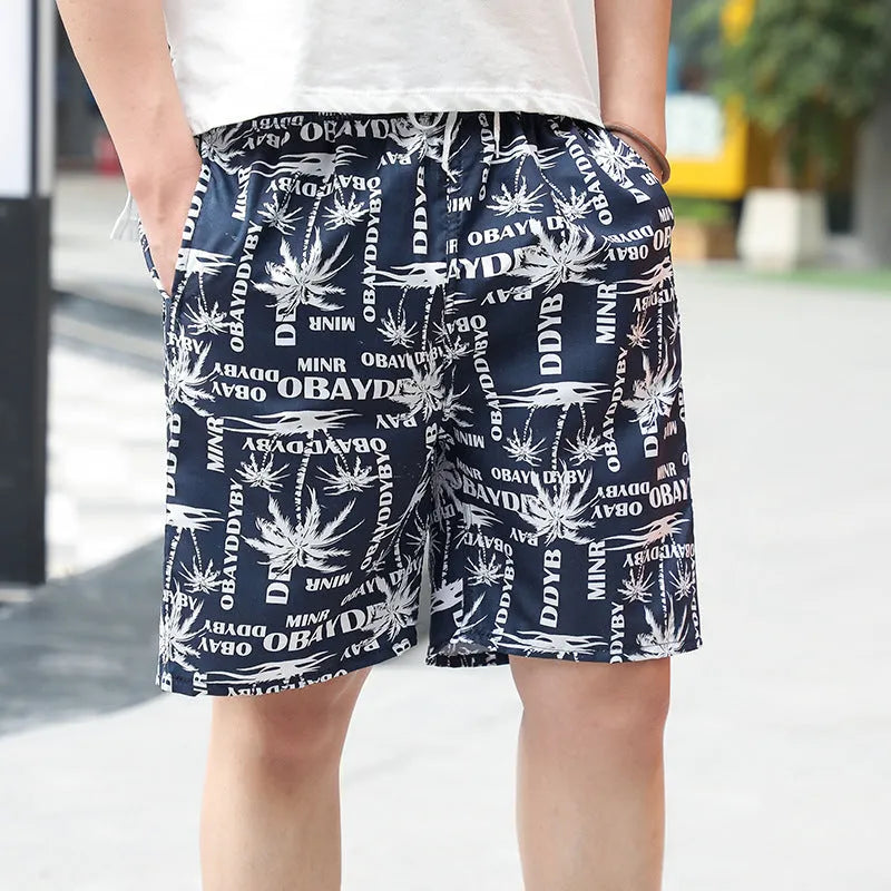 Men's floral printed swimming trunks in polyester fabric showing multiple pattern options for beach and pool use