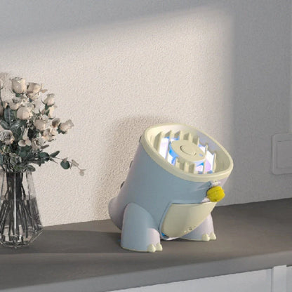 Dinosaur Mosquito Killing Lamp in pink, green, and blue options on a white background