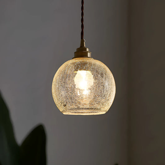 Compact spherical brass and glass ball chandelier with copper finish and clear glass shade, shown in diamond colour.