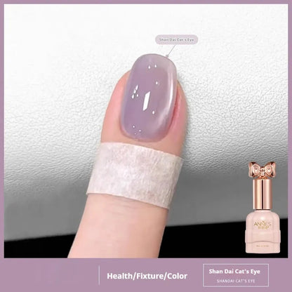 Bottle of micro glass bead cat's eye gel nail polish for magnetic nail art.