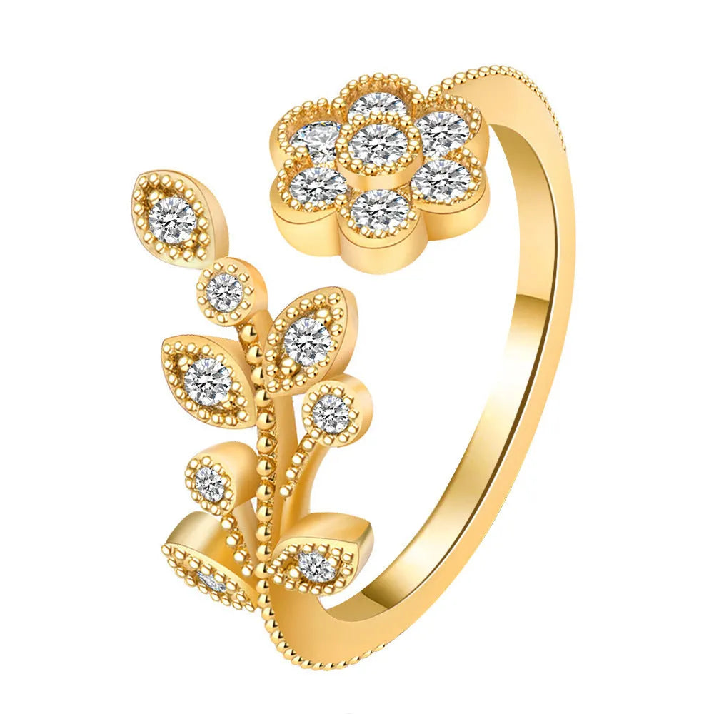 Women's copper open ring with diamond-treated flower and leaf design in gold colour.