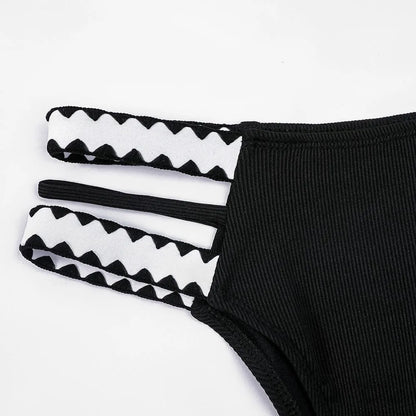 Black hollowed-out split briefs swimsuit for women made from polyester fabric