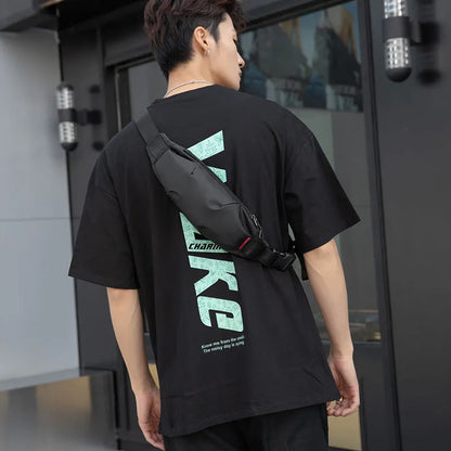 Black Oxford cloth waist pack measuring 12cm high by 27cm wide with crossbody strap and zipper closure
