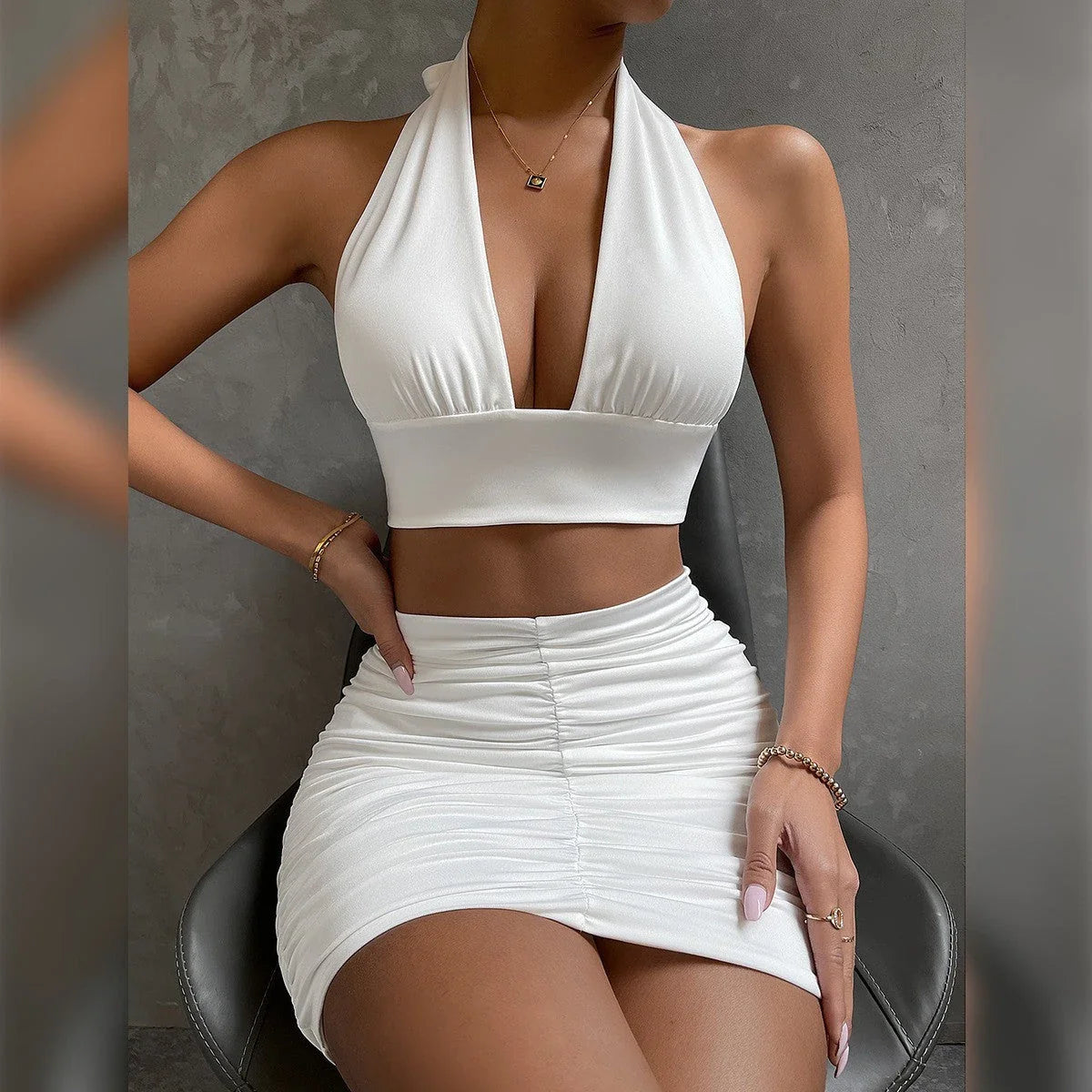 Stylish halter crop top with lace-up detail and pleated mini skirt set in various colors