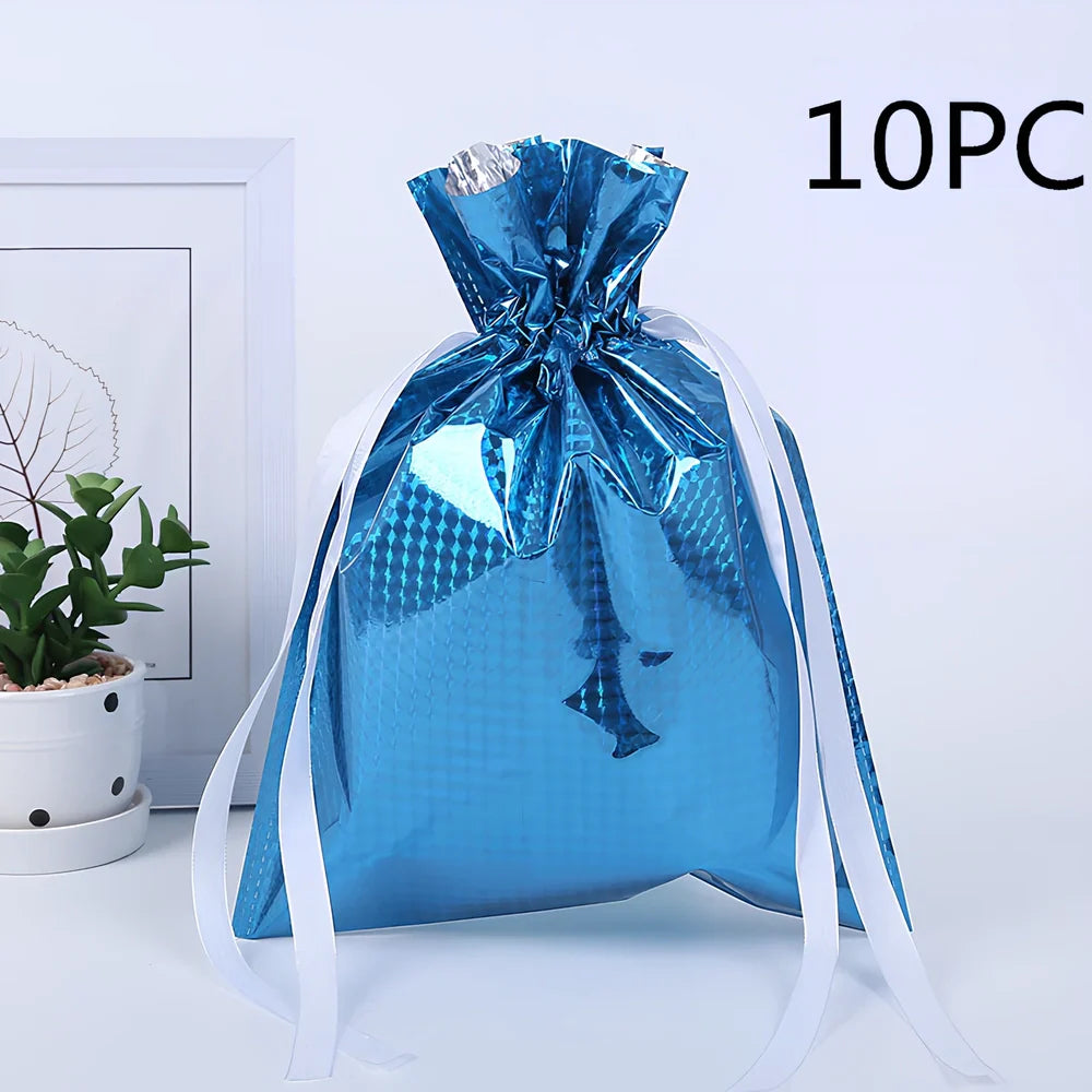 Christmas gift bag with drawstring closure in laser gold finish, 32x24cm dimensions