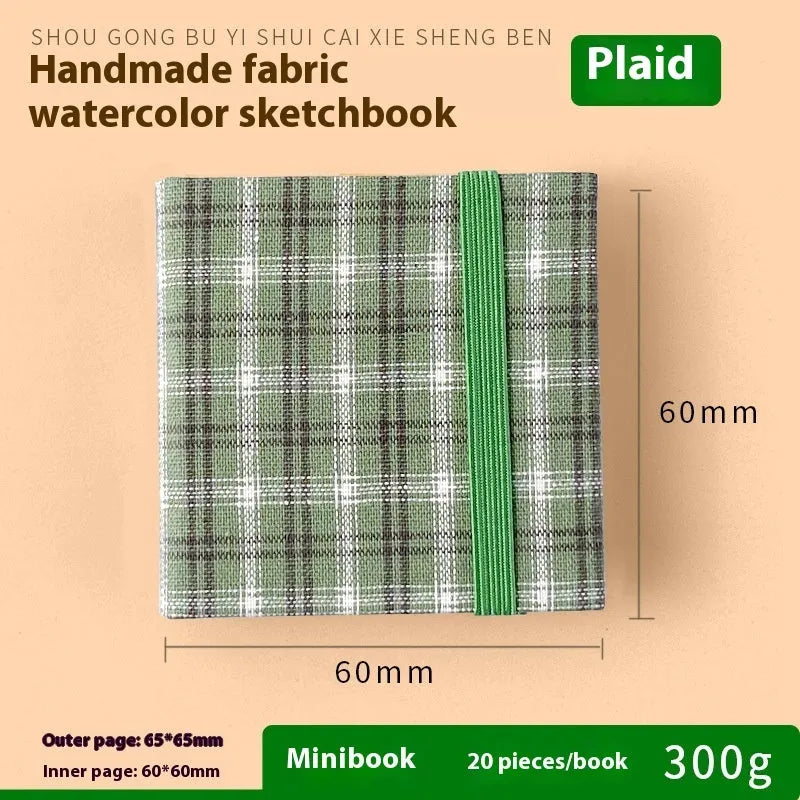 Feiluniao watercolour notebook with fabric cover, 185mm length, open to show paper for painting.