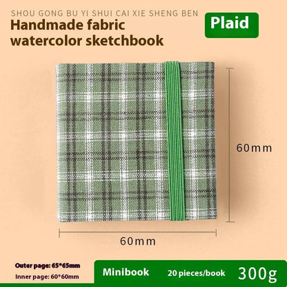 Feiluniao watercolour notebook with fabric cover, 185mm length, open to show paper for painting.