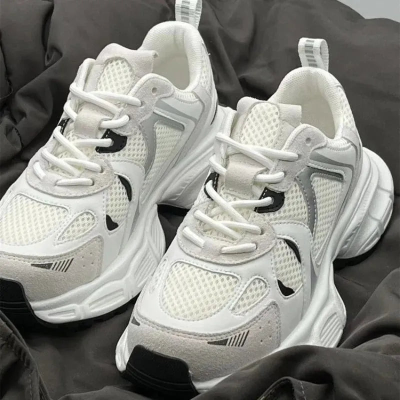 Beige Polar Wave mesh platform trainers with a wedge heel and lace-up front.